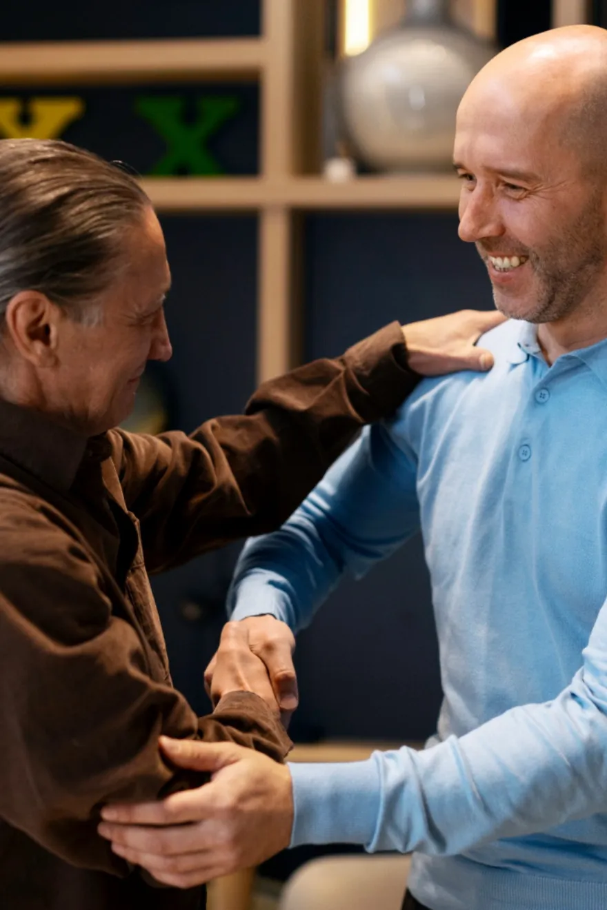 A support worker chatting with a man at home